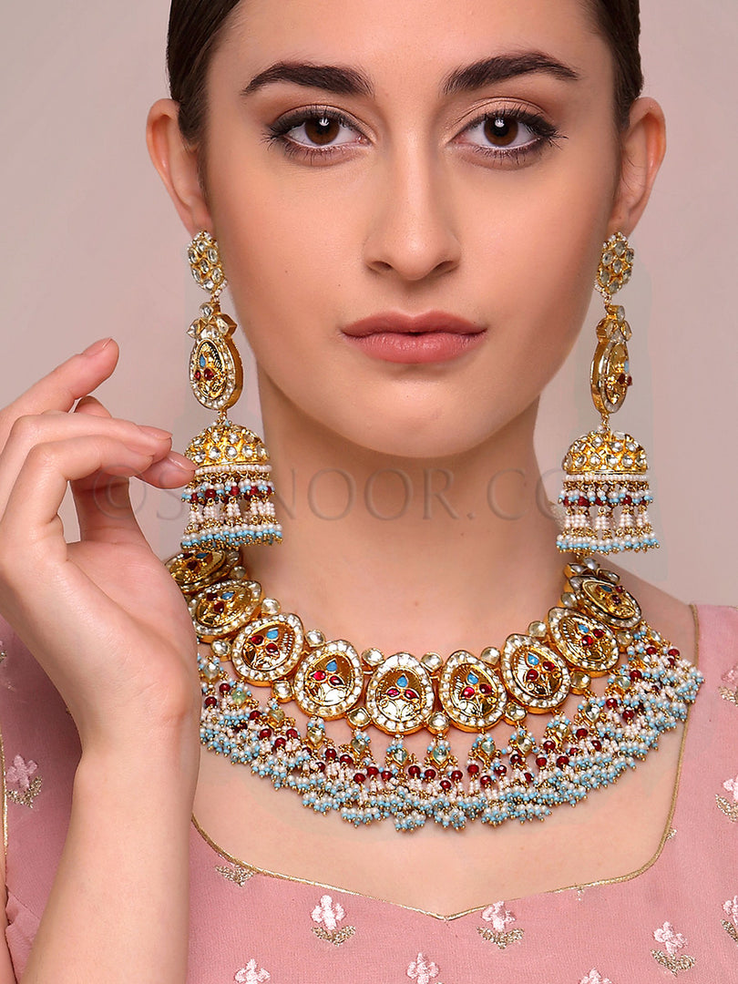Navya Gold Handcrafted Bridal Set With Blue & Red Stone Earrings